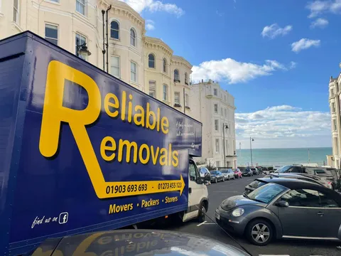 Reliable Removals branded van parked on the Worthing seafront
