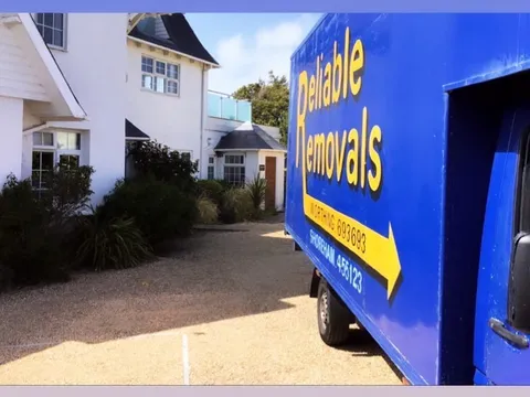 Reliable Removals team handling office equipment during a commercial move