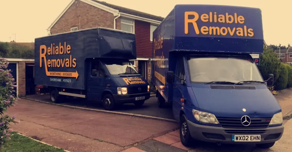 Reliable Removals van on the road near Worthing